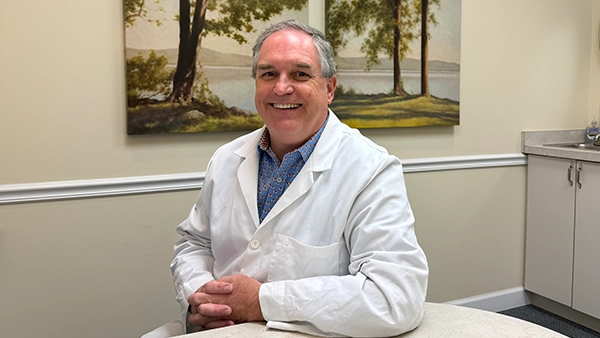 Orthodontist P. Todd Bonner Smiling In Lab Coat